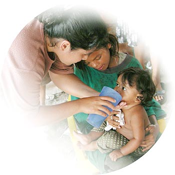 Woman feeding baby image