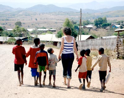 Children walking along a road image